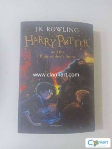 Harry Potter and the philosopher stone by j.k. Rowling
